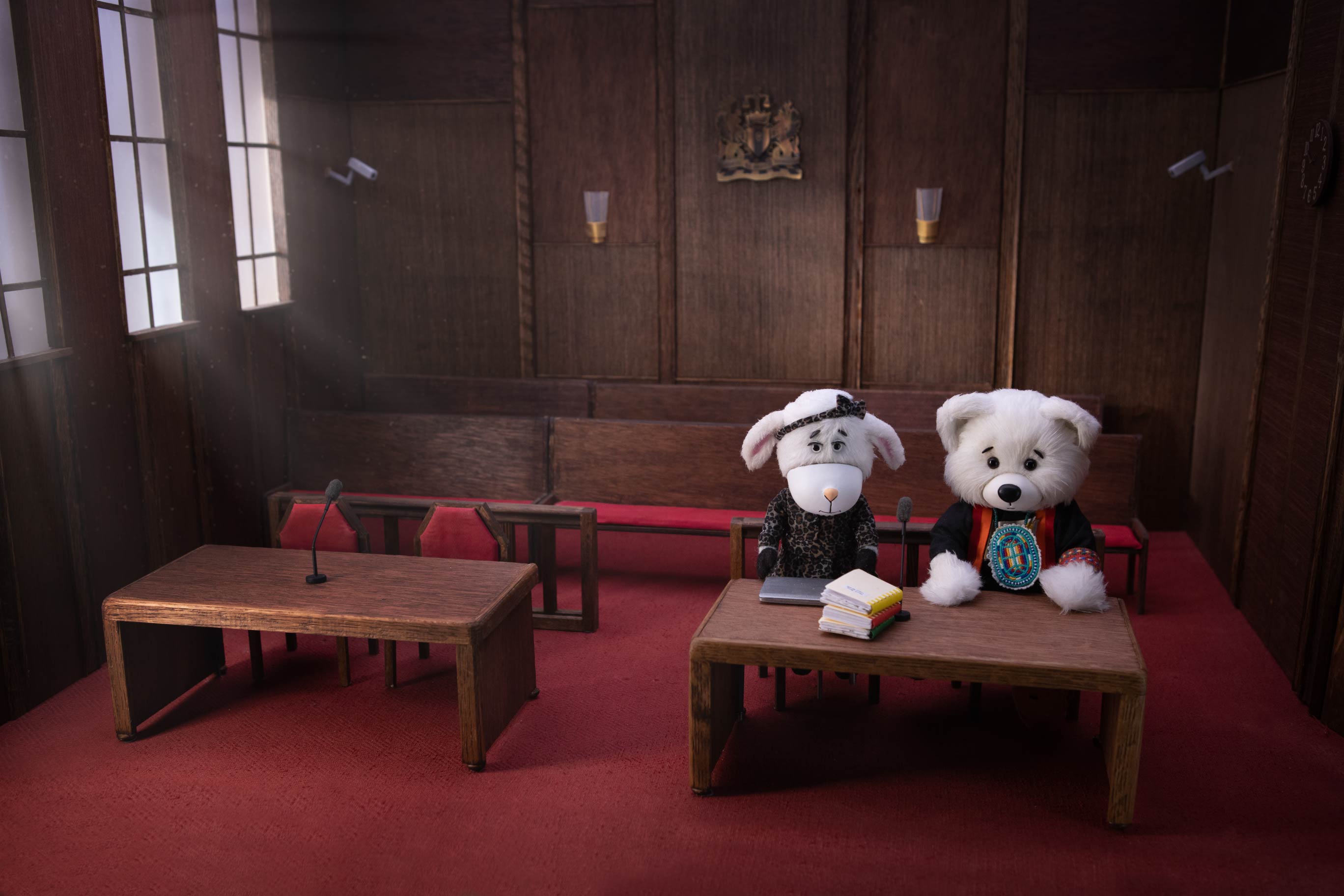 Movie still of Spirit Bear and Cindy the Sheep in the Tribunal