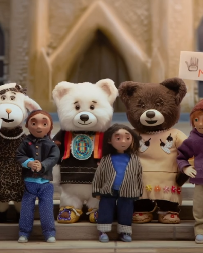 Still from Spirit Bear movie showing kids and bears on Parliament Hill Still from Spirit Bear movie showing kids and bears on Parliament Hill