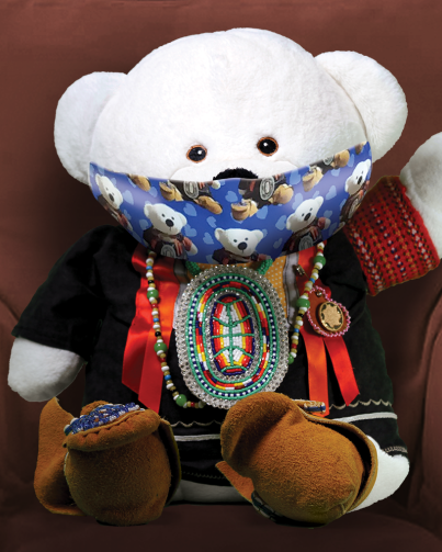photo of Spirit Bear wearing a mask, sitting in a comfy chair, waving at you. of Spirit Bear wearing a mask, sitting in a comfy chair, waving at you.S