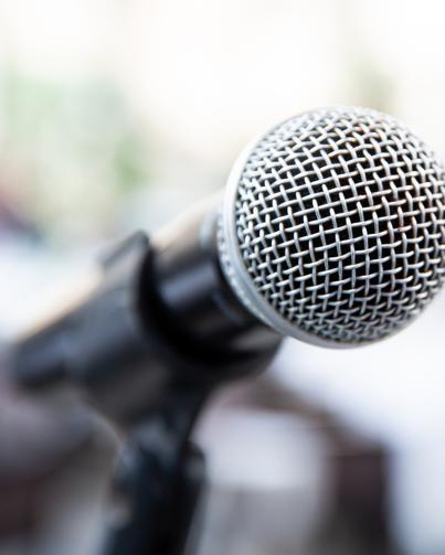 tight close up shot of a microphone against a blurred background