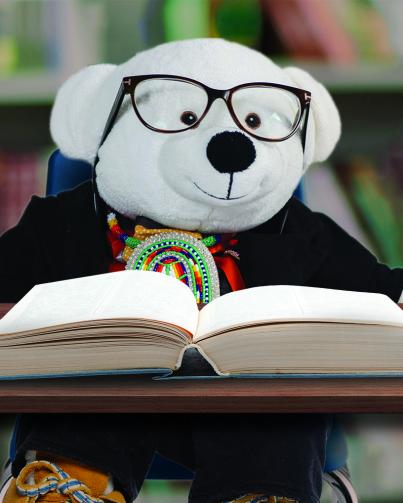 Spirit Bear with glasses and book Spirit Bear reading a book